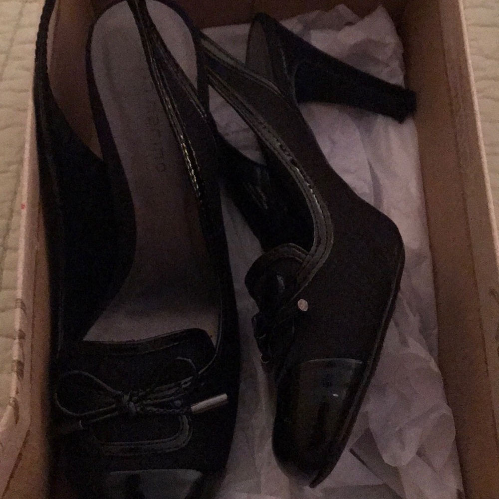 Black sling back shoes.